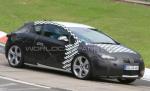 Opel Astra GTC 2011, surprins la teste pe circuitul Nordschleife de la Nürburgring (FOTO)