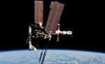NASA a publicat primele imagini din istorie cu o navă americană conectată la Staţia Spaţială Internaţională