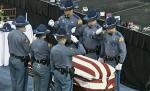 Eroul român din Washington, condus pe ultimul drum de mii de americani. În memoria sa, drapelele au fost coborâte în bernă