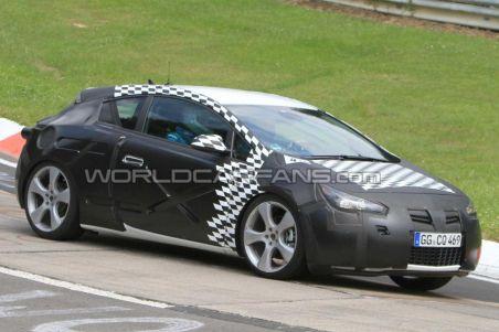 Opel Astra GTC 2011, surprins la teste pe circuitul Nordschleife de la Nürburgring (FOTO)