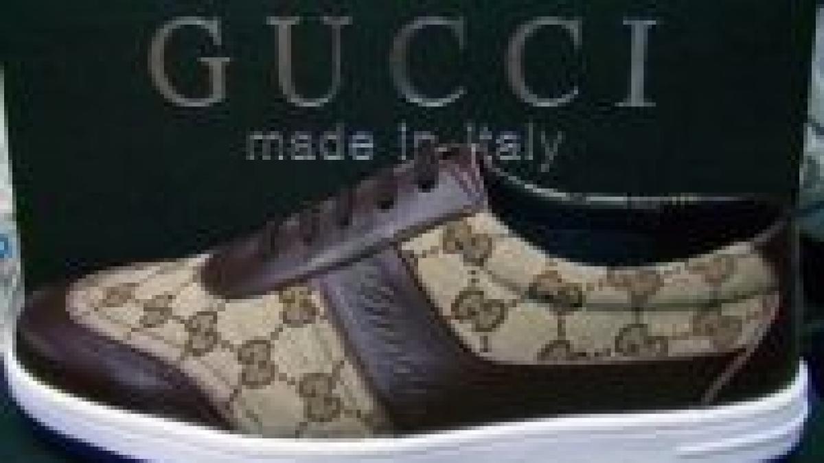 detinatorul gucci vrea sa achizitioneze puma