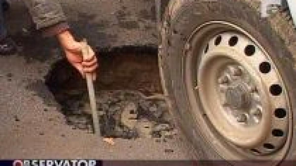 asfaltul din parcarea de la dna a cedat sub greutatea unor masini