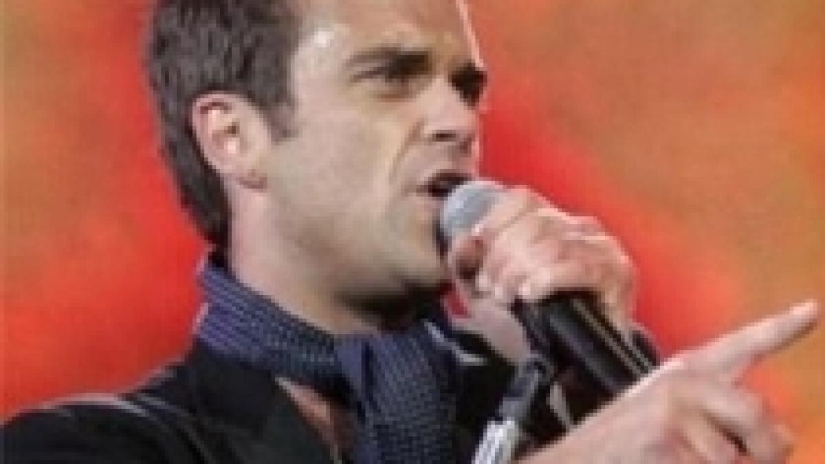 robbie williams vrea sa adopte doi copii din haiti video