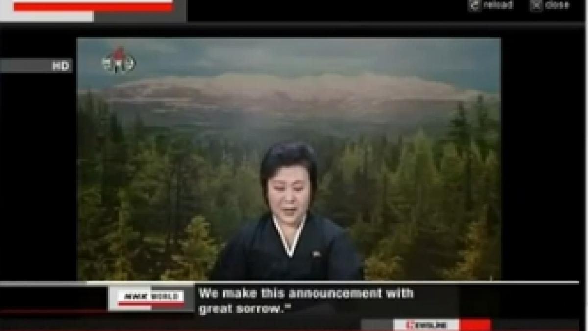 decesul liderului kim jong il anuntat cu ochii in lacrimi de o prezentatoare imbracata in negru