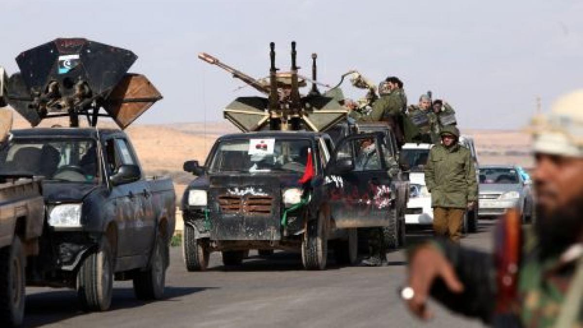 libia cnt a adotat legea electorala persoanele cu dubla cetatenie au dreptul sa candideze