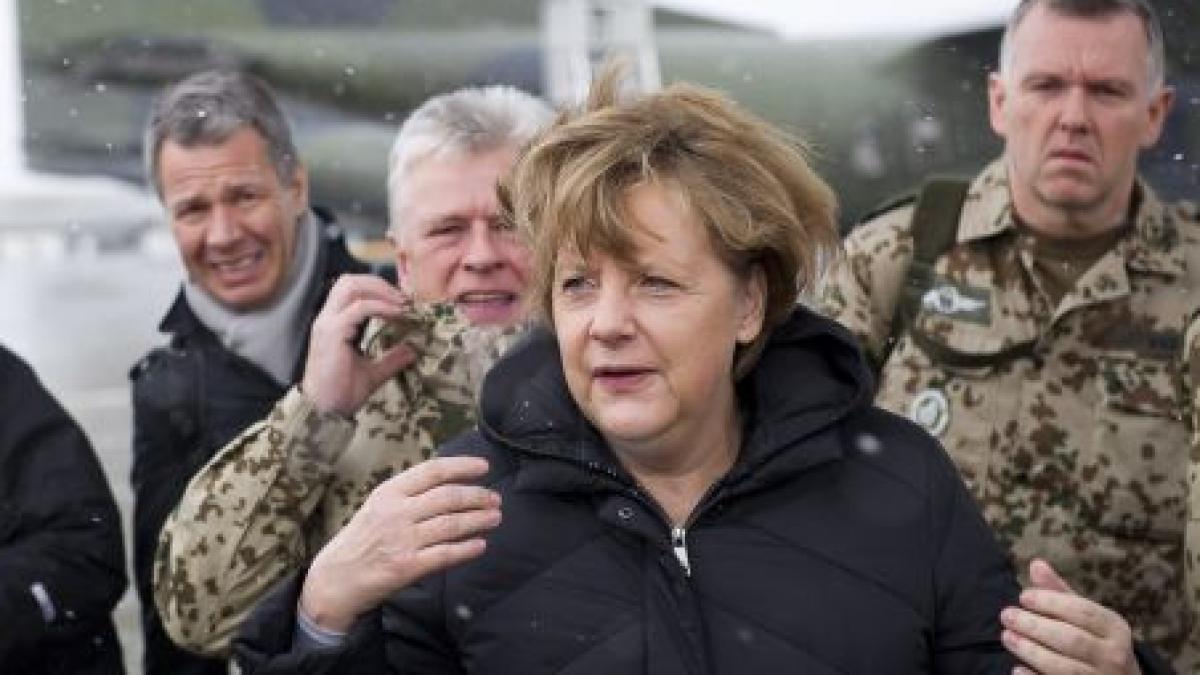 angela merkel intr o vizita surpriza in afganistan o retragere totala a armatei germane prevazuta