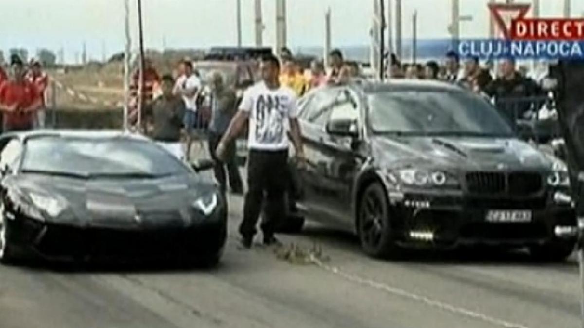 liniuta intre un lamborghini aventador si un bmw x6 de 900 de cai