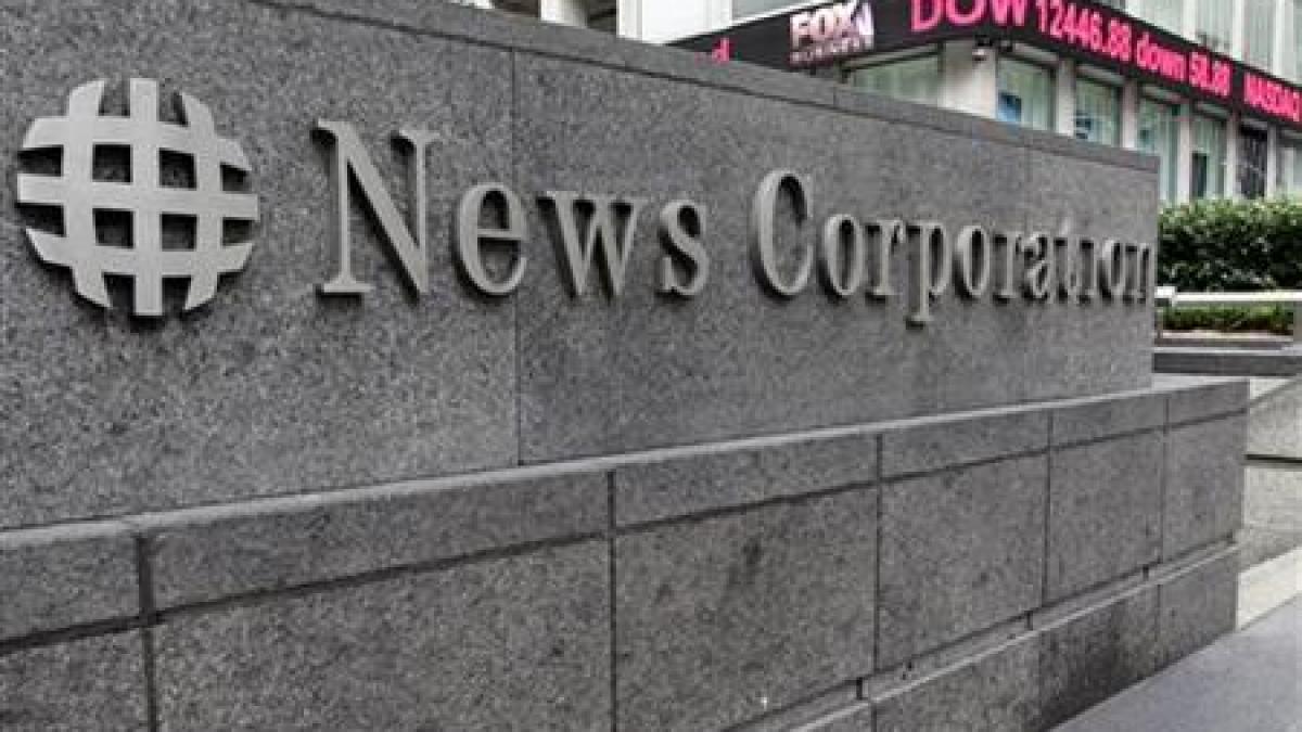 scandalul news corporation continua un politist si doi jurnalisti au fost arestati