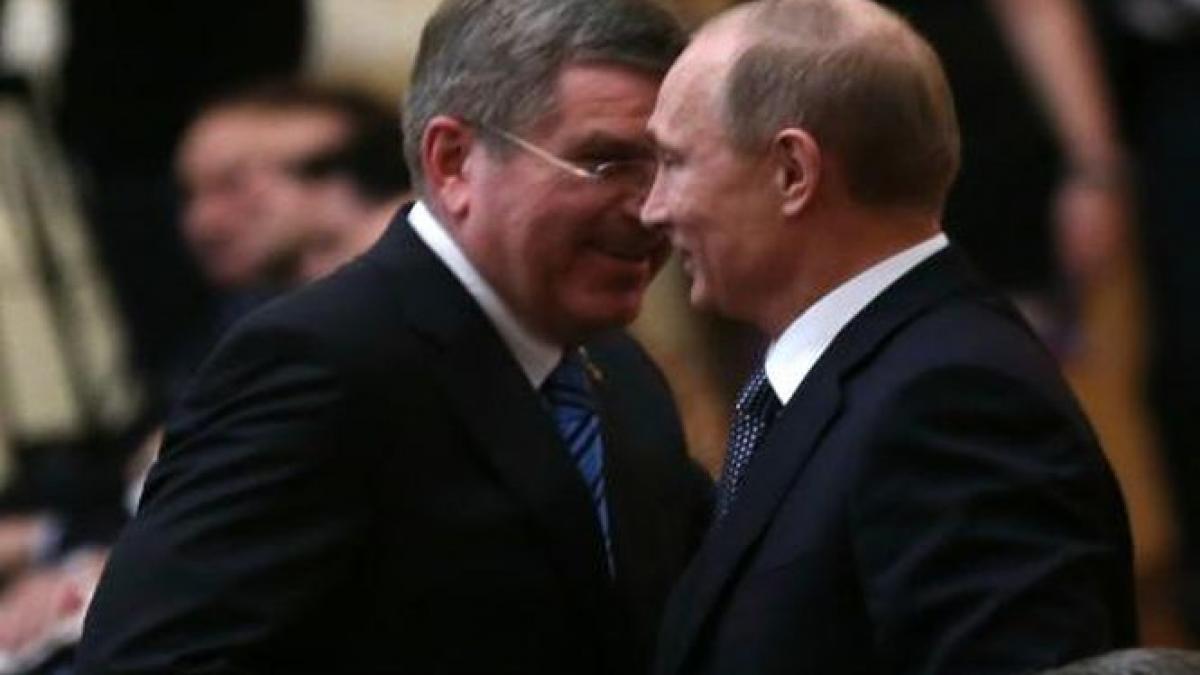 vladimir putin laudat de presedintele comitetului international olimpic