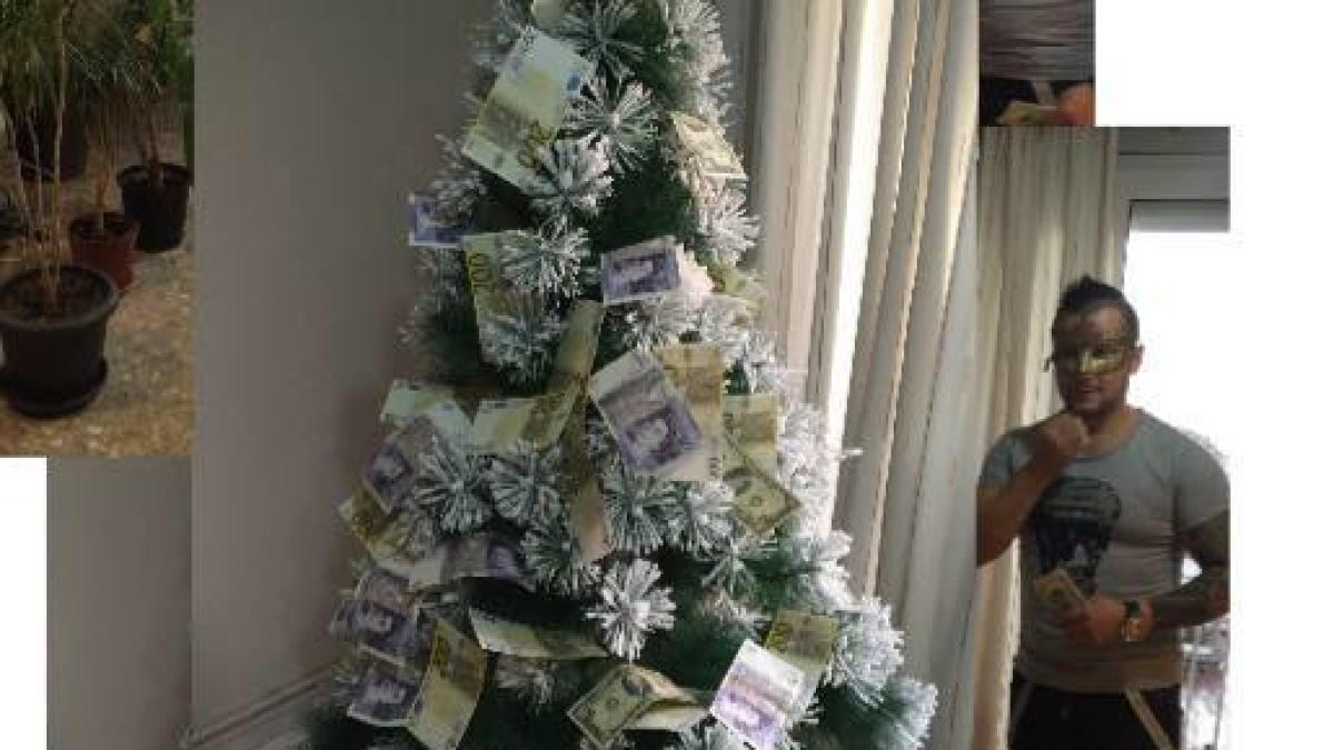 aroganta de craciun impresarul celui mai cautat roman pe google si a impodobit bradul cu valuta