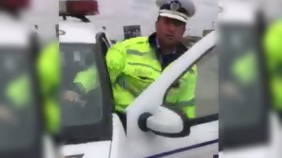 politist filmat in timp ce bruscheaza un sofer video