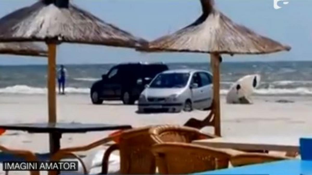 a intrat cu masina pe plaja si a ramas impotmolita in nisip cat trebuie sa scoata acum din buzunar