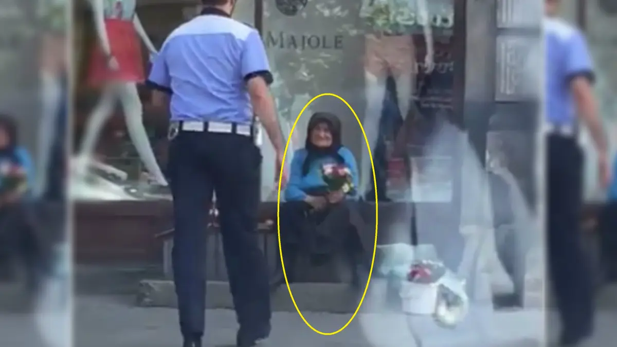 un politist se apropie de o batranica ce vinde flori la marginea bulevardului ce a urmat a starnit