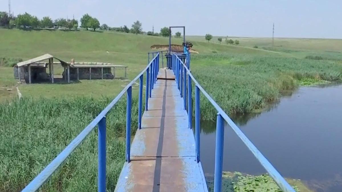 descoperire socanta intr un lac din caracal ramasite si haine gasite intr o valiza