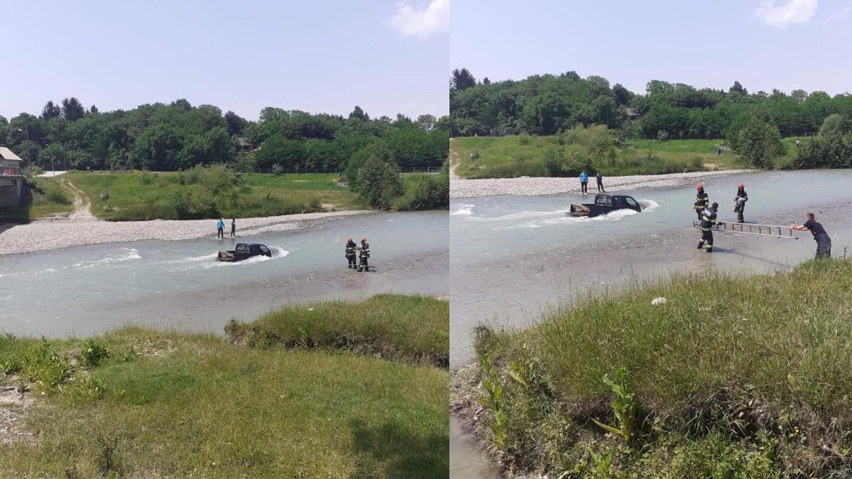 doua persoane spele masina rau luate viitura