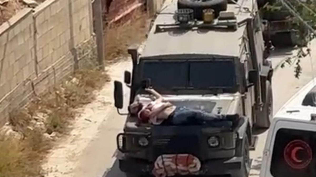 imagini virale cu un palestinian ranit legat pe capota unui jeep militar israelian