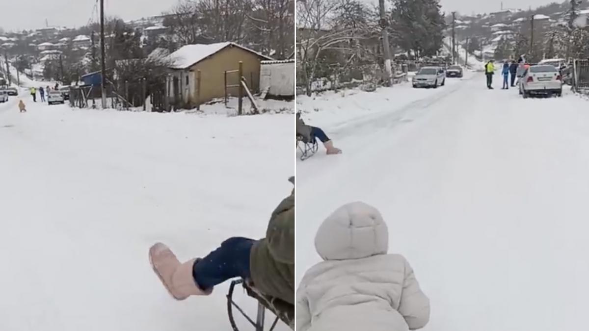 decizie inedita intr o comuna din constanta aflata sub cod galben de ninsori o strada a fost inchisa si facuta derdelus pentru copiii