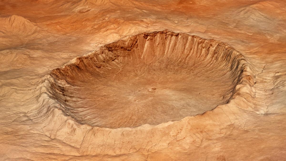 un crater misterios care ascunde urme de apa gheata si activitate vulcanica a fost descoperit pe marte