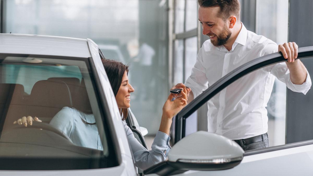 salesman-woman-looking-car-car-showroom