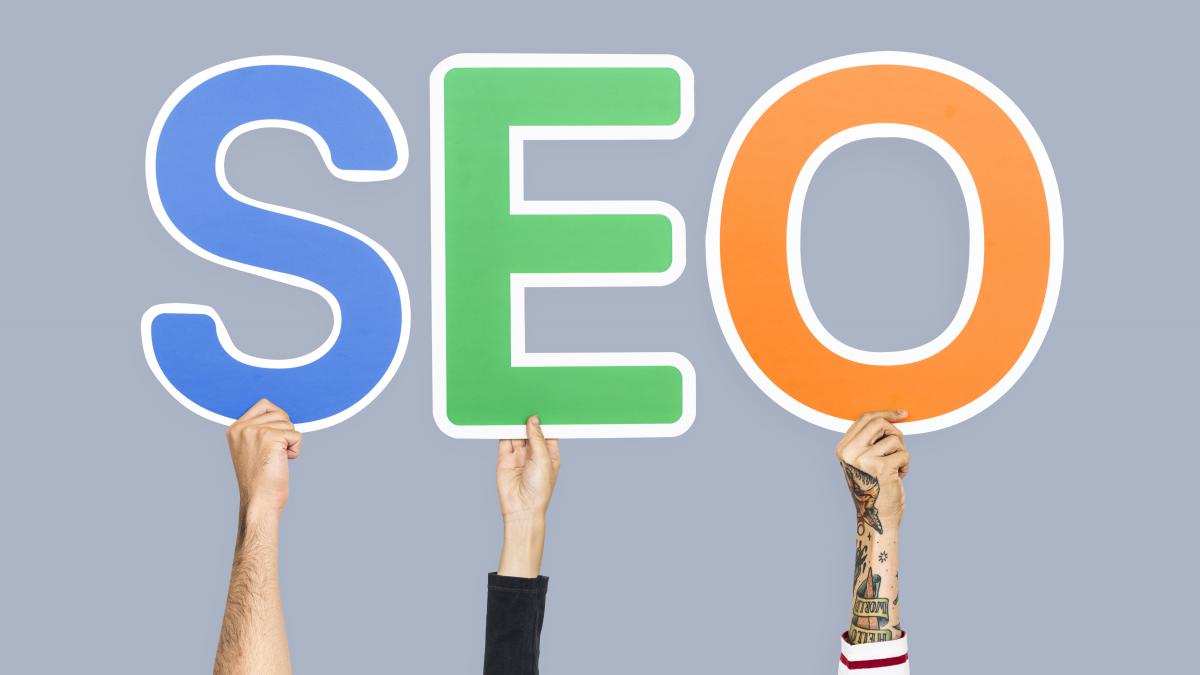 hands-holding-up-colorful-letters-forming-abbreviation-seo