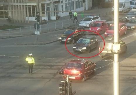 Imagini șocante în Oradea! Polițist rutier, lovit în plin de o mașină în timp ce dirija circulația 
