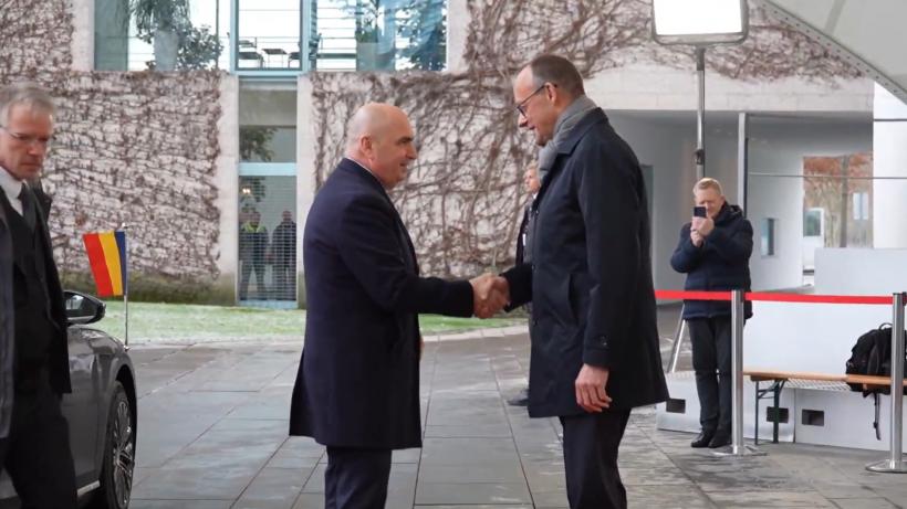 Premierul Ilie Bolojan a fost primit de cancelarul german Friedrich Merz. Ce discută cei doi