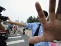 Un jurnalist britanic a fost brutalizat de poliţia din Beijing