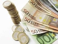 Adoptarea monedei euro de România ar putea fi amânată din cauza crizei financiare