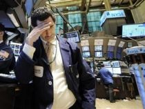 Bursele din SUA au închis pe roşu, înainte de publicarea rezultatelor testelor de stres

