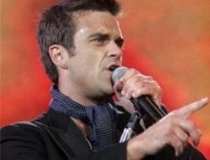 Robbie Williams vrea să adopte doi copii din Haiti (VIDEO)