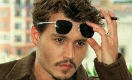 Johnny Depp a fost muşcat de câinele cuplului Angelina Jolie-Brad Pitt