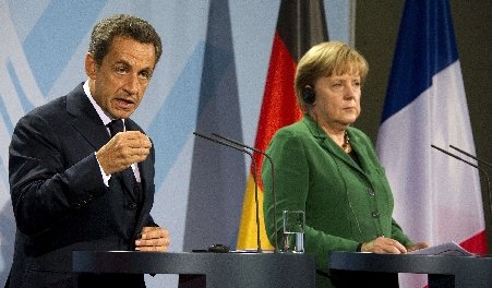 Sarkozy şi Merkel au promis un plan anticriză, în cel mai scurt timp posibil