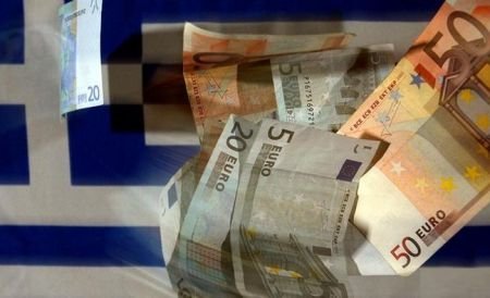Miniştrii de Finanţe din zona euro au aprobat al doilea acord pentru Grecia