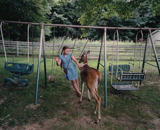 Vezi o galerie foto impresionantă cu fetiţa care iubeşte toate animalele 207092