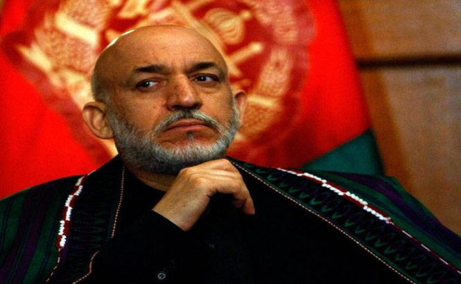 Preşedintele afgan negociază în secret cu talibanii