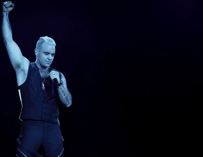 Spectatorii la concertul lui Robbie Williams vor primi drept scuze...