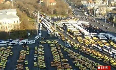 Transport workers turn Bucharest into car park