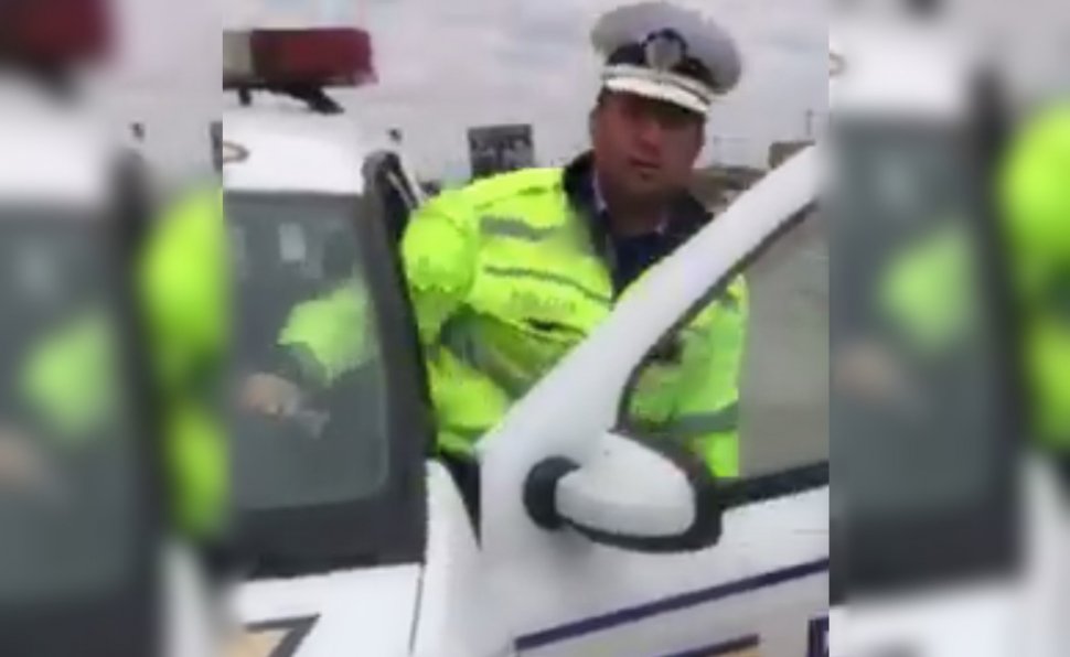 Polițist filmat în timp ce bruschează un șofer - VIDEO 