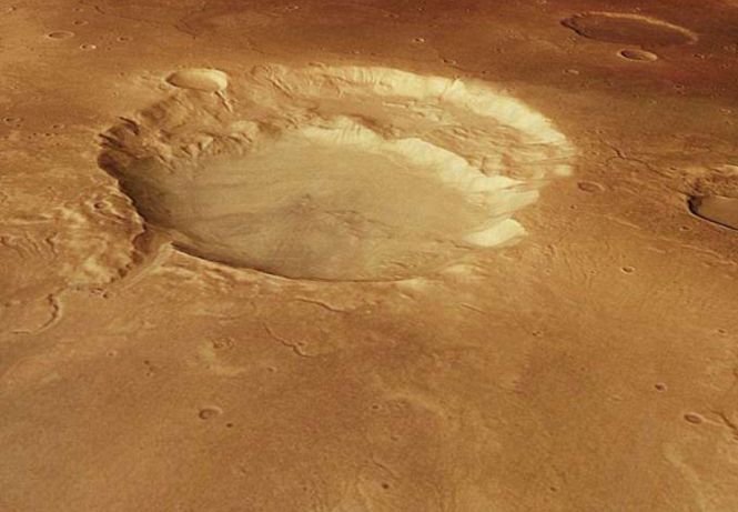 Un crater uriaș a fost observat pe Marte. Nimeni nu știe cum s-a format 