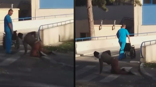Imagini șocante surprinse în fața unui spital din România. Un bărbat se târăște în genunchi pe stradă, după ce a fost externat - VIDEO