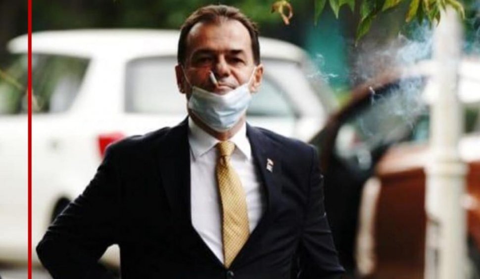 Ludovic Orban, fotografiat în timp ce fuma cu masca de protecție sub bărbie