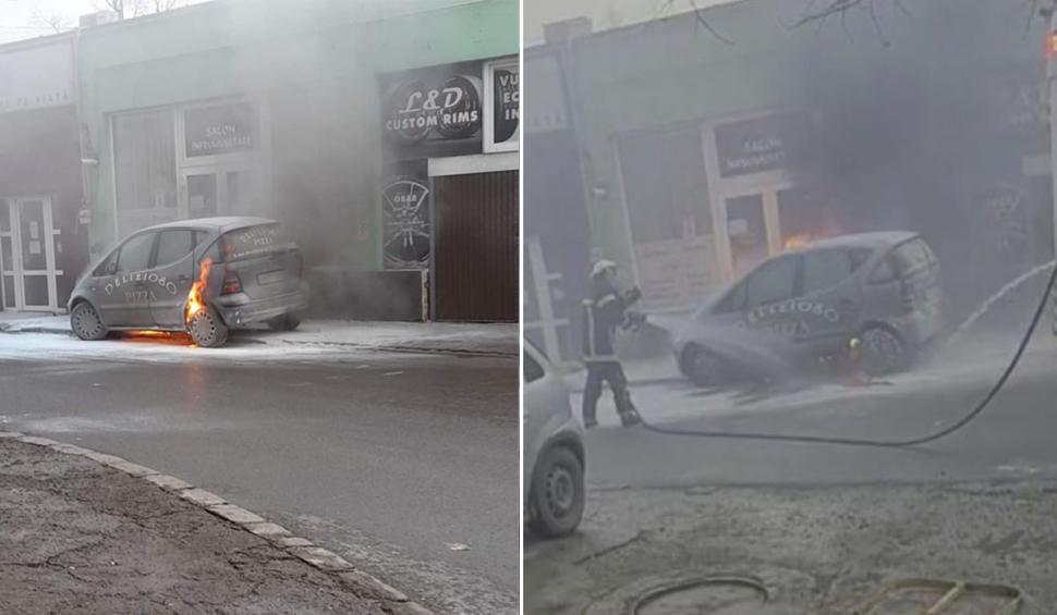 O maşină a luat foc în faţa unei pizzerii din Arad