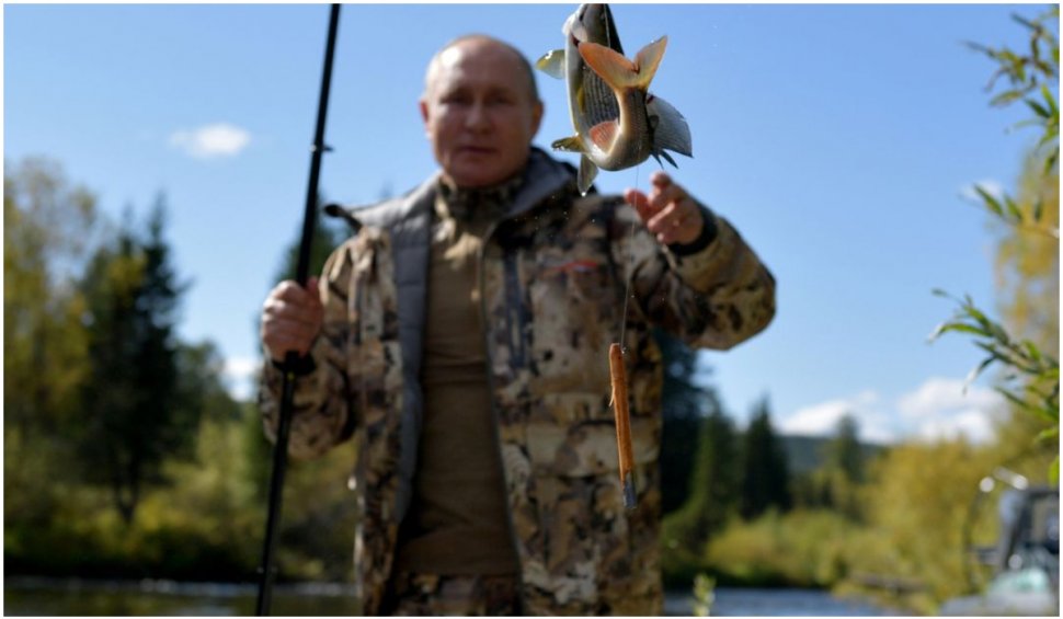 La pescuit: președintele Vladimir Putin a fost surprins de aparatele de fotografiat într-o scurtă vacanță