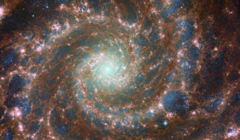 Fotografie uimitoare cu "Galaxia Fantomă", publicată de NASA: Se poate observa clar roiul nuclear de stele din centru