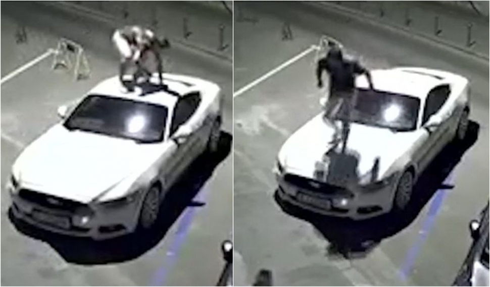 Un tânăr dansează pe plafonul unei maşini parcate lângă Poliţia Capitalei, apoi sare pe capota autoturismului