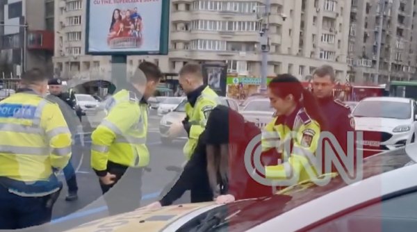 Momentul în care o femeie este încătușată în fața Guvernului. Detalii despre operațiunea polițiștilor din București