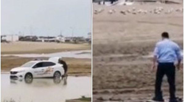 Imagini demne de ”cascadorii râsului” | Doi polițiști din Constanța au rămas cu mașina împotmolită pe plajă: ”Și-a băgat picioarele în saci de gunoi”
