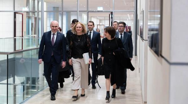 bolojan dupa intalnirea cu merz vizita a intarit parteneriatele economice si strategice ce a discutat si cu romani din germania