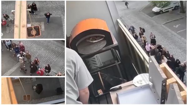 un tanar din oslo si a transformat balconul apartamentului in pizzerie a coborat pe sfoara in strada 70 de comenzi in 90 de minute