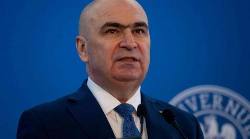 Bolojan se pregătește să dea, pentru a doua oară, foc Constituției. Legea interzicerii cumulului pensiei cu salariul la stat frizează trei decizii anterioare ale CCR